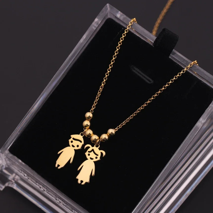 Collar de joyería para niños con diseño de niño y niña en acero inoxidable, estilo europeo y americano, de JewerlyDreams.